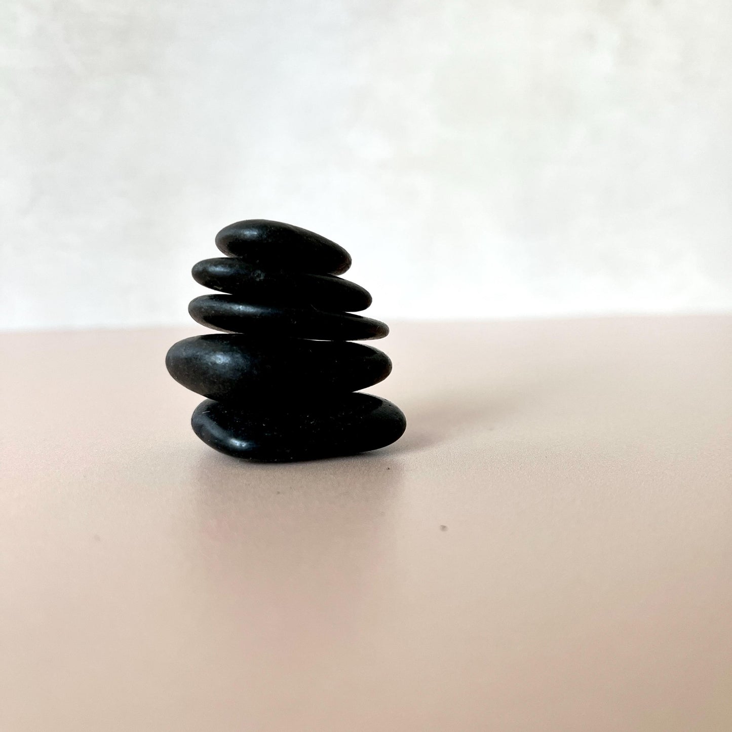 Polished black stones with smooth glossy finish