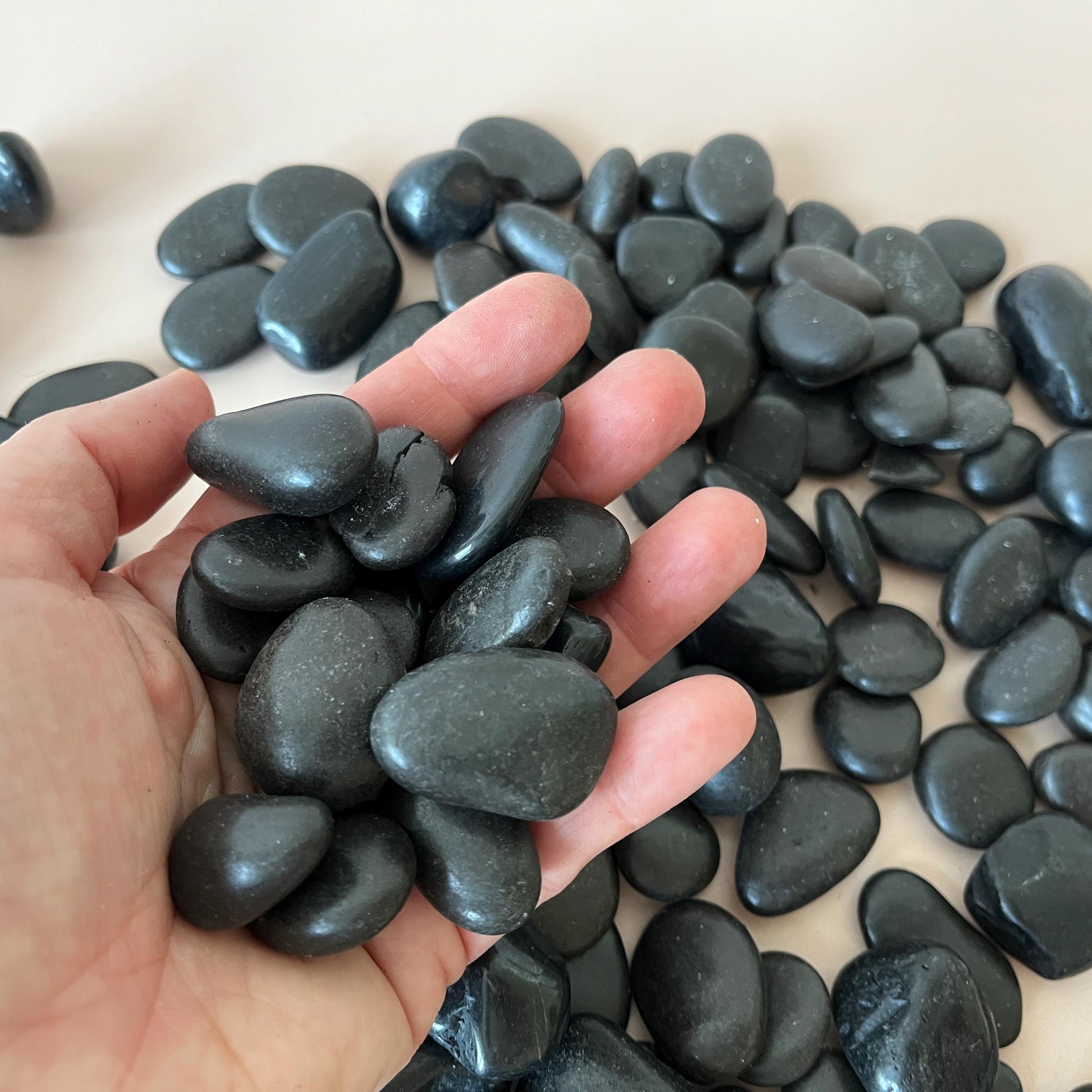 Smooth black stones for stacking and styling