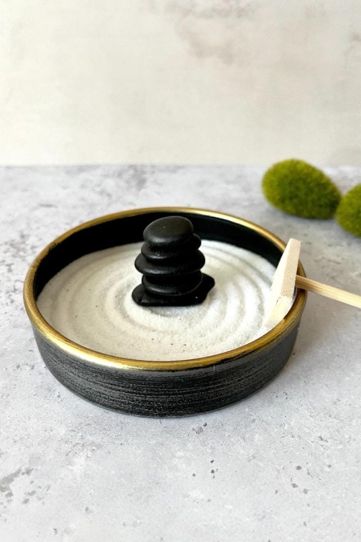 Black stones on a desk as a calming decor object