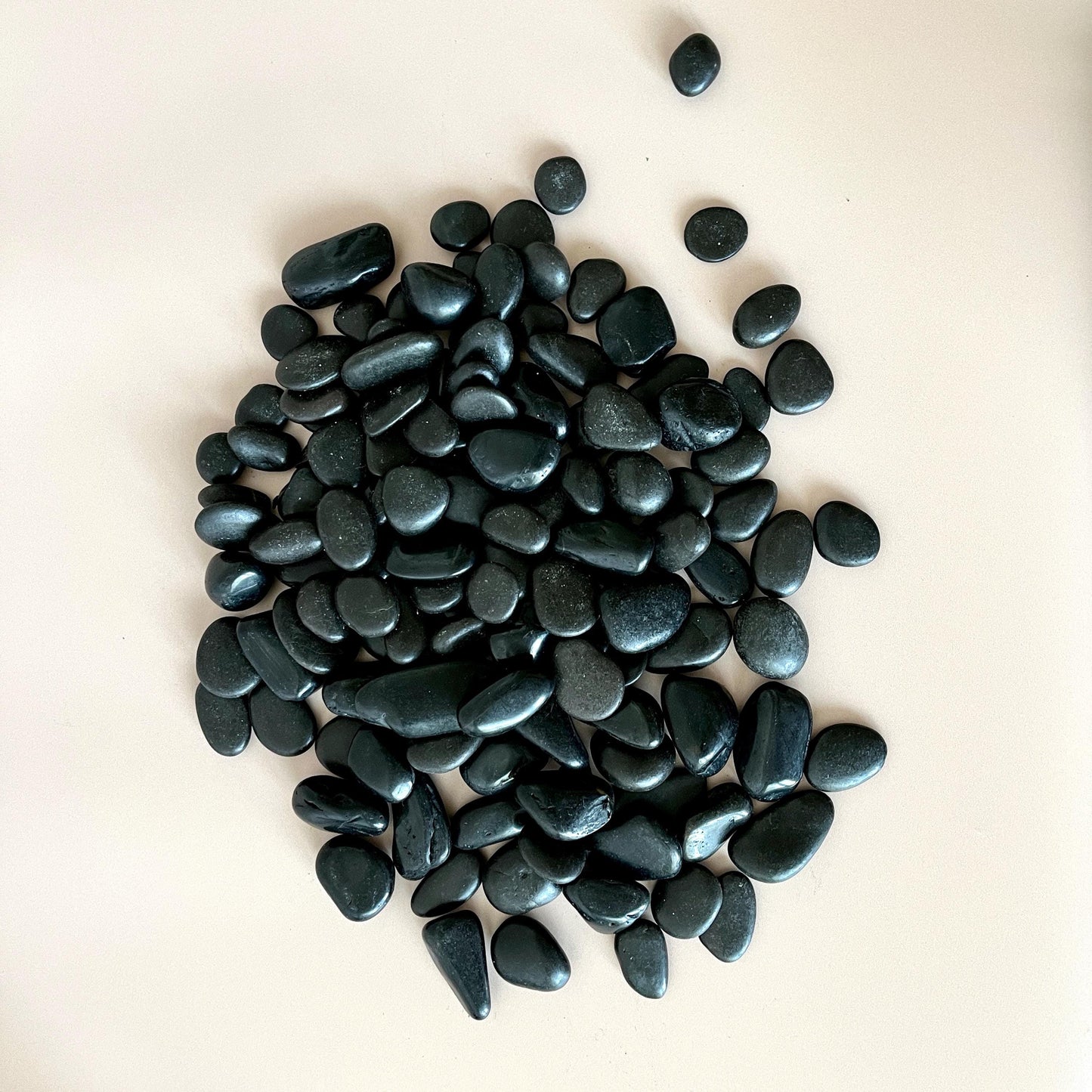 Black meditation stones arranged for display