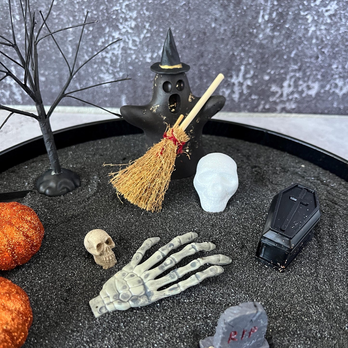 Complete Halloween zen garden scene with pumpkins and coffin
