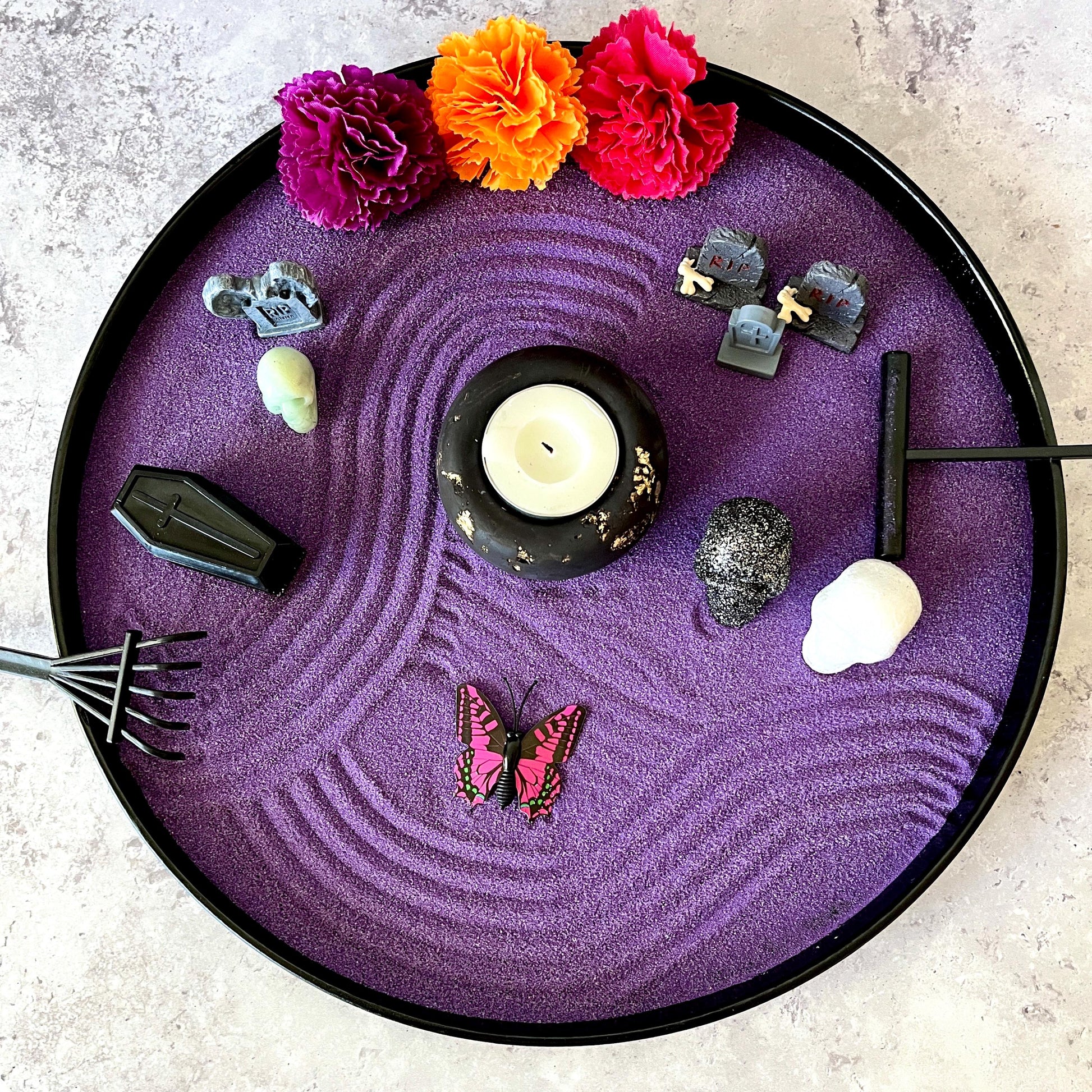 Crystal skull memorial zen garden with purple sand