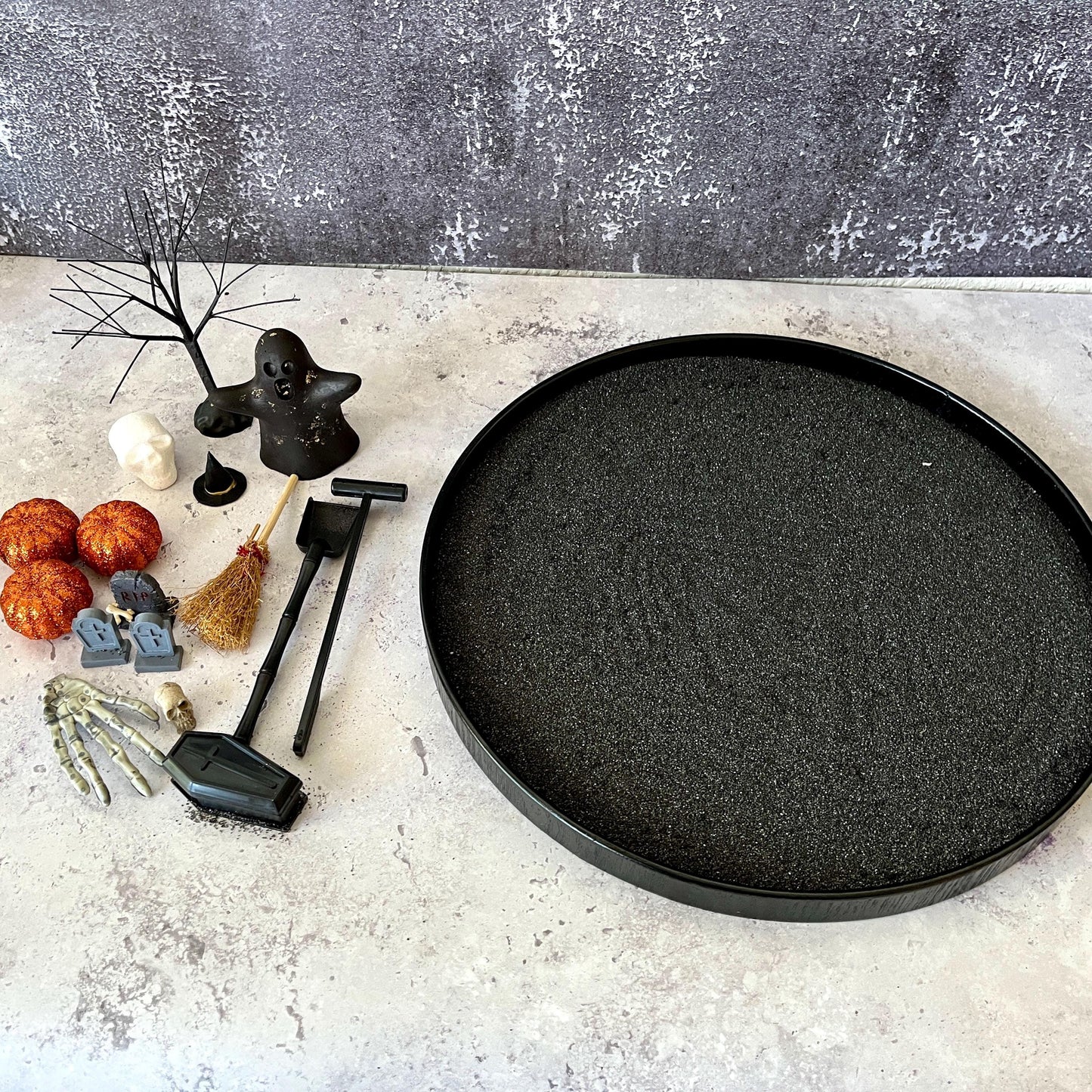 Halloween zen garden kit contents including ghost, pumpkins, and tombstones